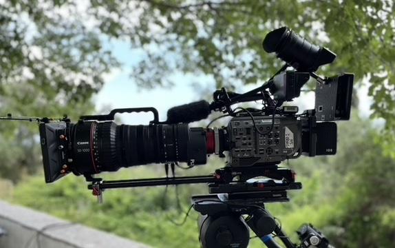 A broadcast camera rig set up on location